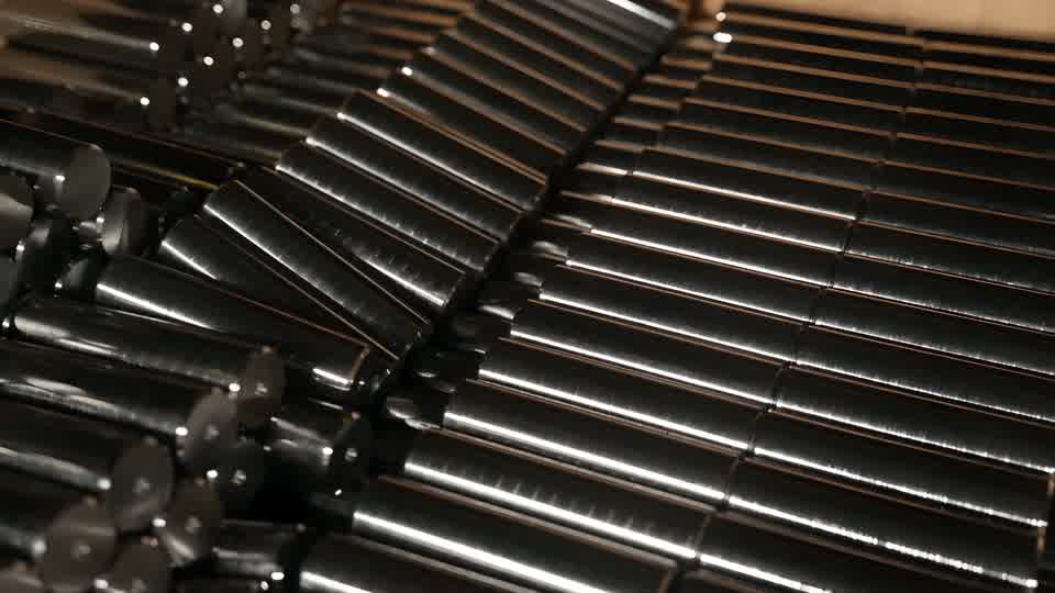 Rows of polished steel bars stacked at the works.